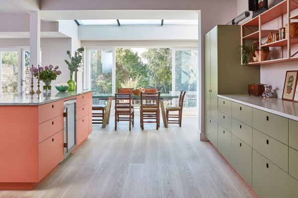 Pink and green Pluck kitchen with natural stone in Dulwich village.