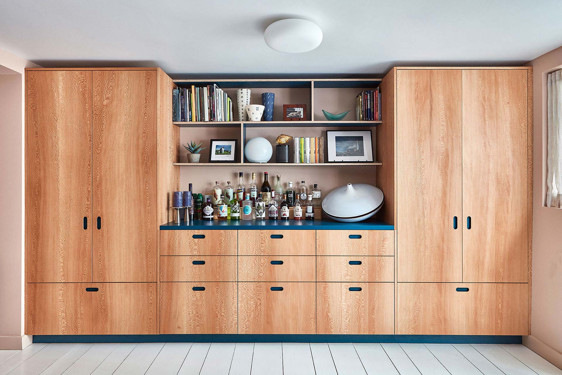London Plane wood and blue galley kitchen in an Islington Townhouse.