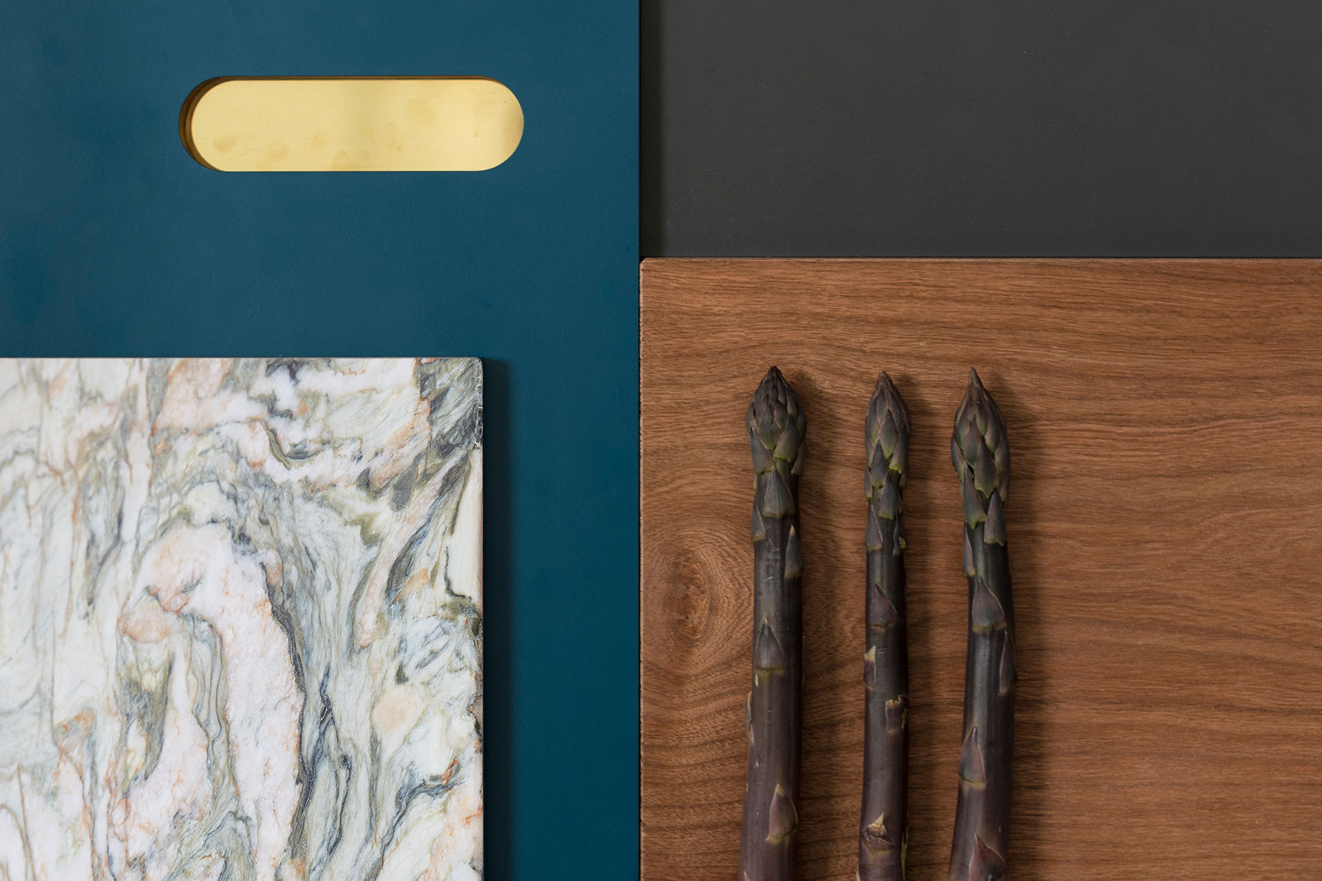 Kitchen colour inspiration with rich blue, dark grey, warm Cherry wood, natural stone quartzite, brass and purple asparagus.