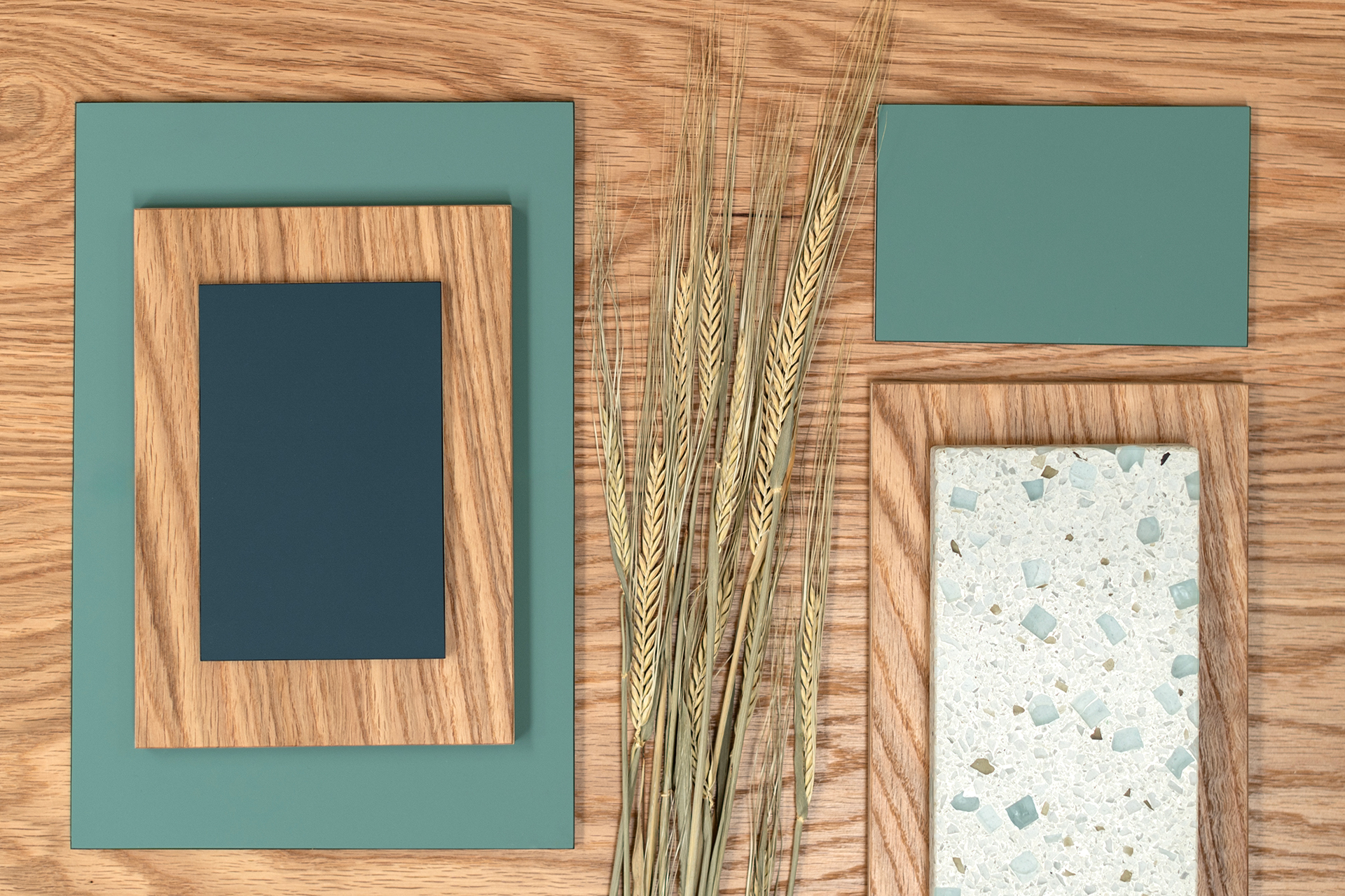 Kitchen eco colour inspiration with soft matt navy blue and teal green fenix, Oak wood grain, glass terrazzo and barley.