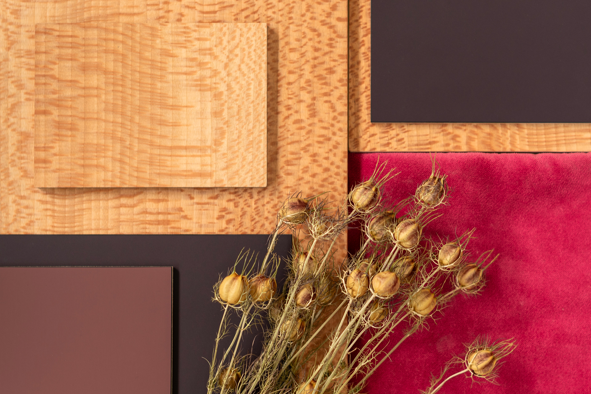 Colour and texture kitchen inspiration with deep purple, raspberry red, London Plane wood, pink velvet and dried flowers.
