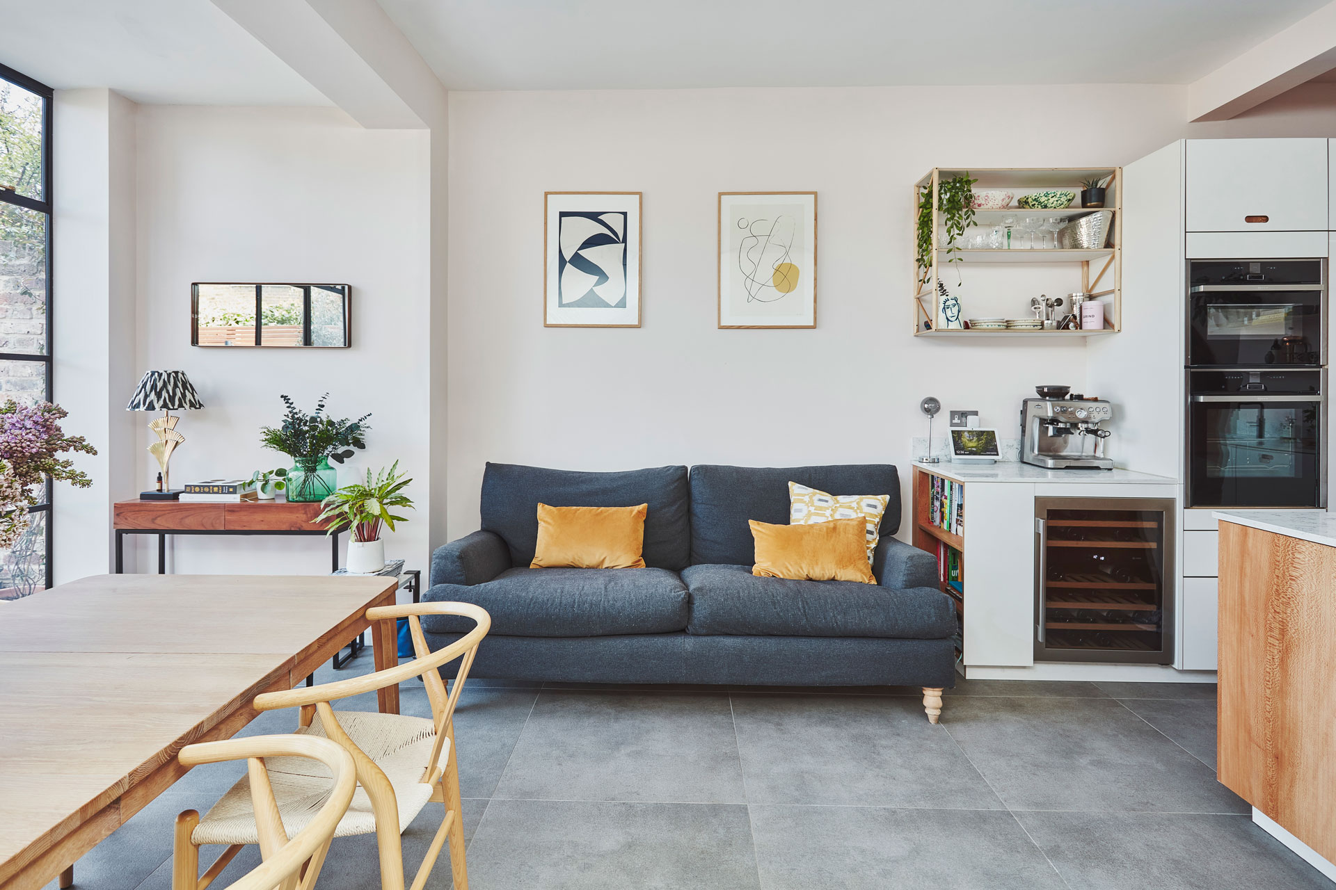 Wood island and white cabinetry kitchen inspiration in Wandsworth.
