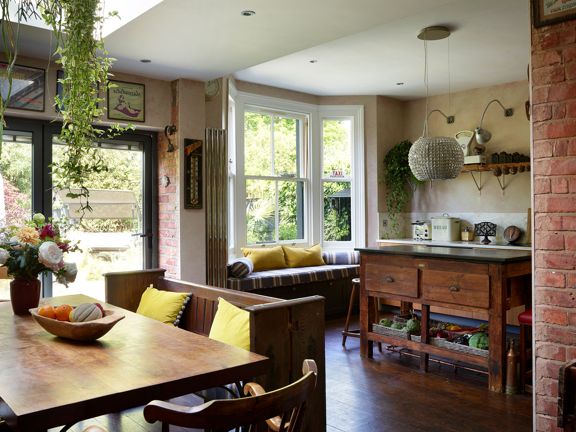 Kitchen mixing old and new with Pluck's cabinets and a freestanding vintage table island.