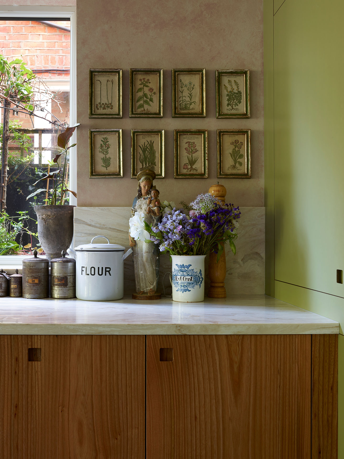 Kitchen mixing old and new with Pluck's cabinets and a freestanding vintage table island.