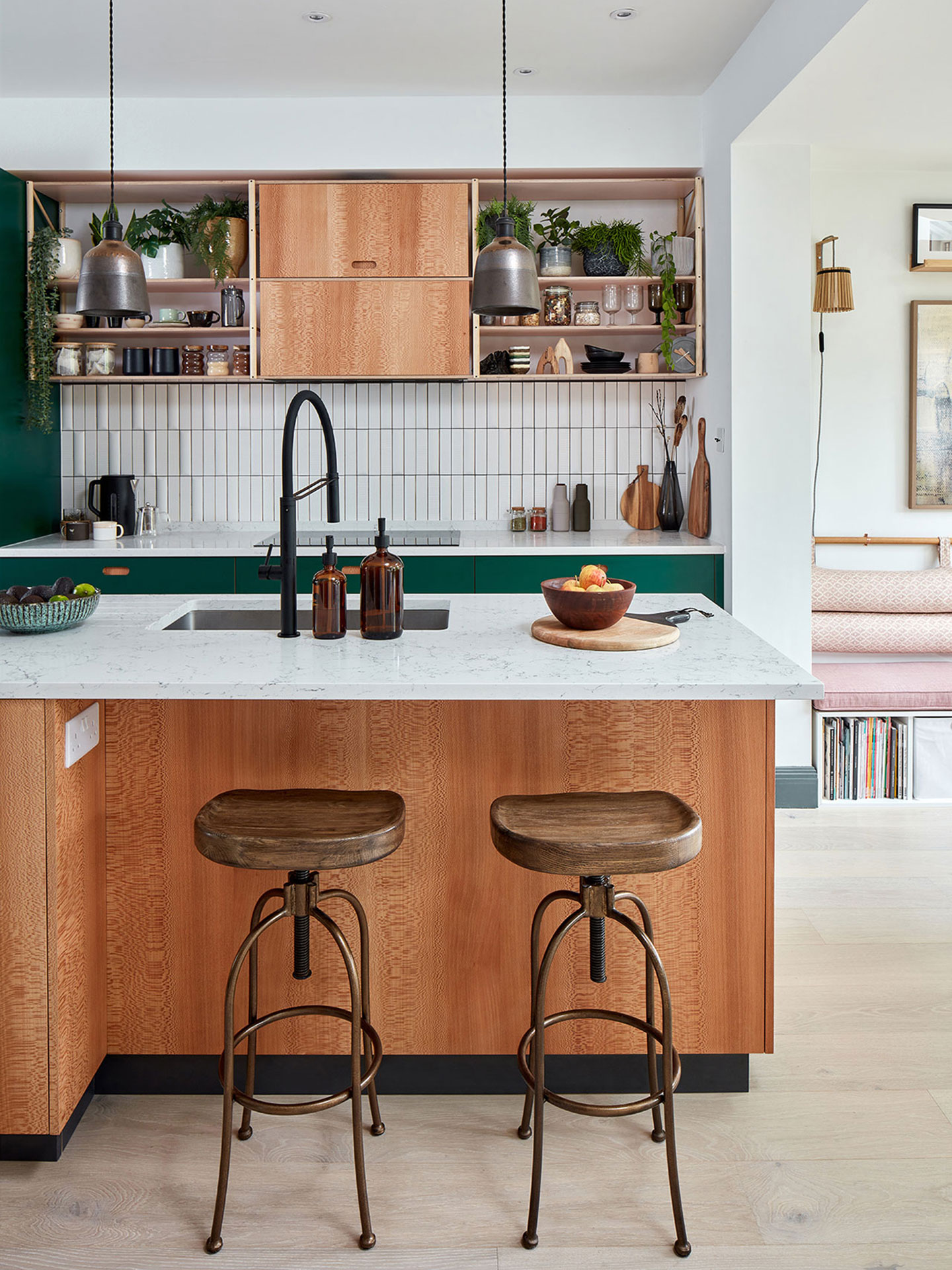 Pluck kitchen in a location house with dark green and London Plane wood cabinets.