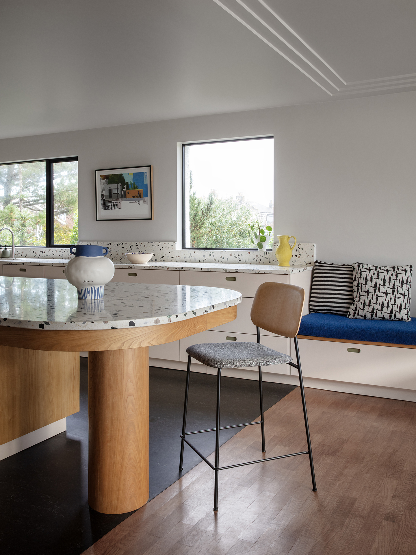 1930's seaside bolthole in Sussex including a soft beige, khaki green and Sweet Chestnut wood kitchen topped with terrazzo.