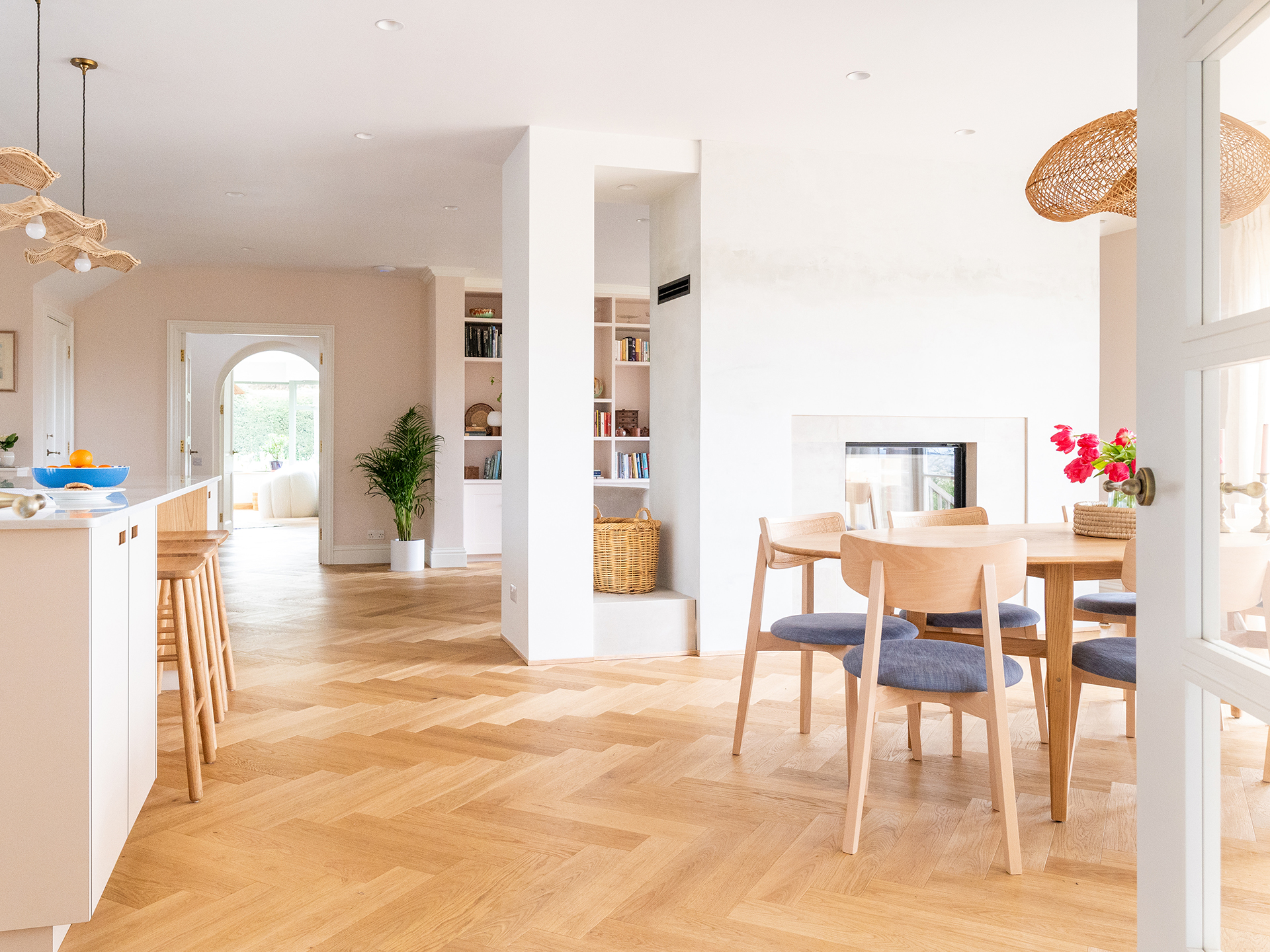 An open plan home in the Surrey Hills with pale beige and Sweet Chestnut wood Pluck cabinetry.