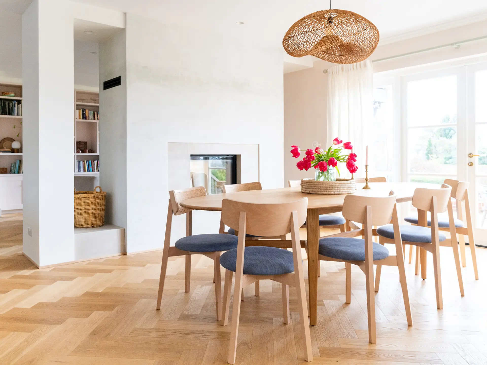 Gorgeous dining area in an open plan home in the Surrey Hills with pale beige and Sweet Chestnut wood Pluck cabinetry.