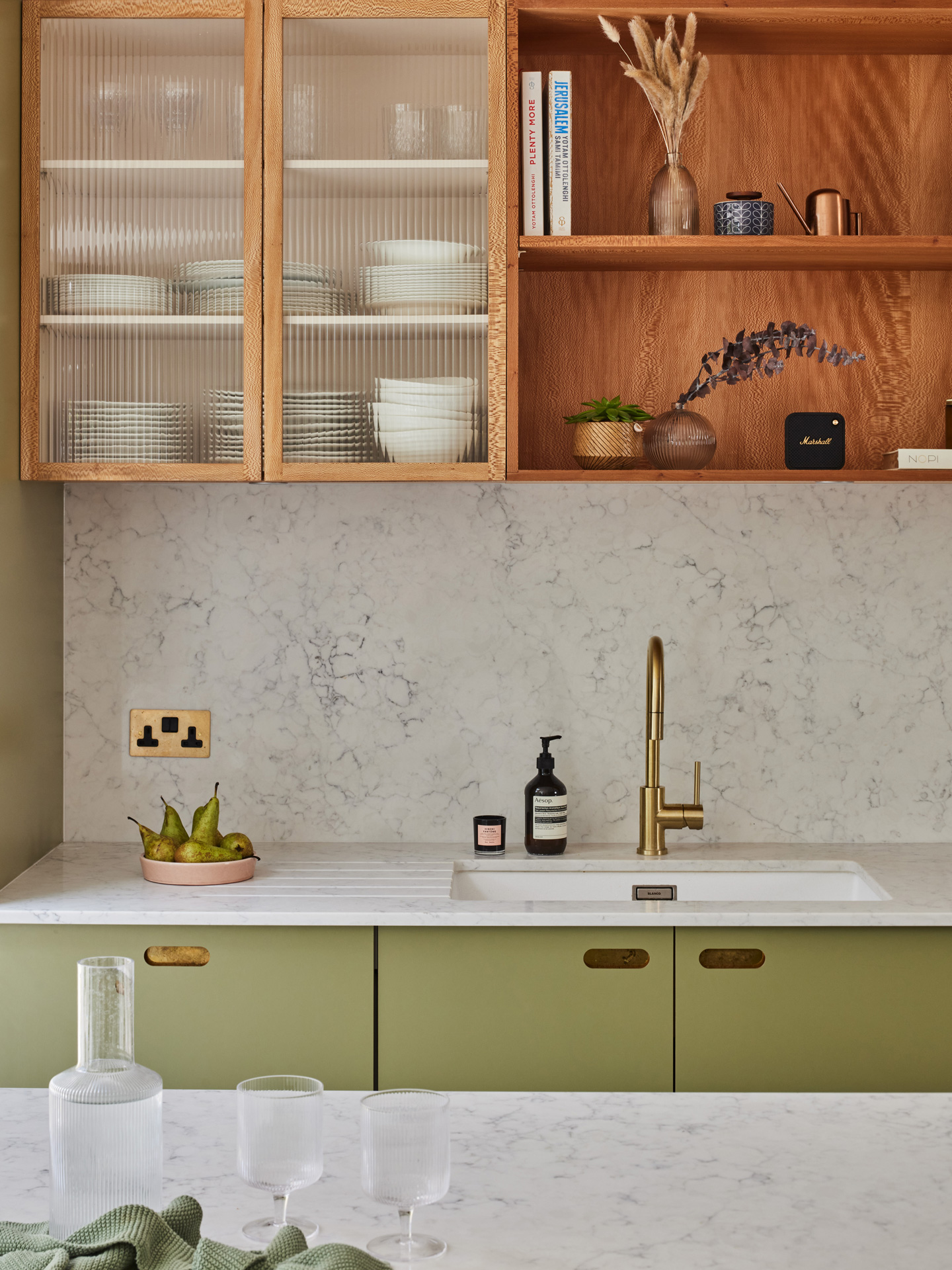 Luxe family home with a green and London Plane wood kitchen including an island and larder.