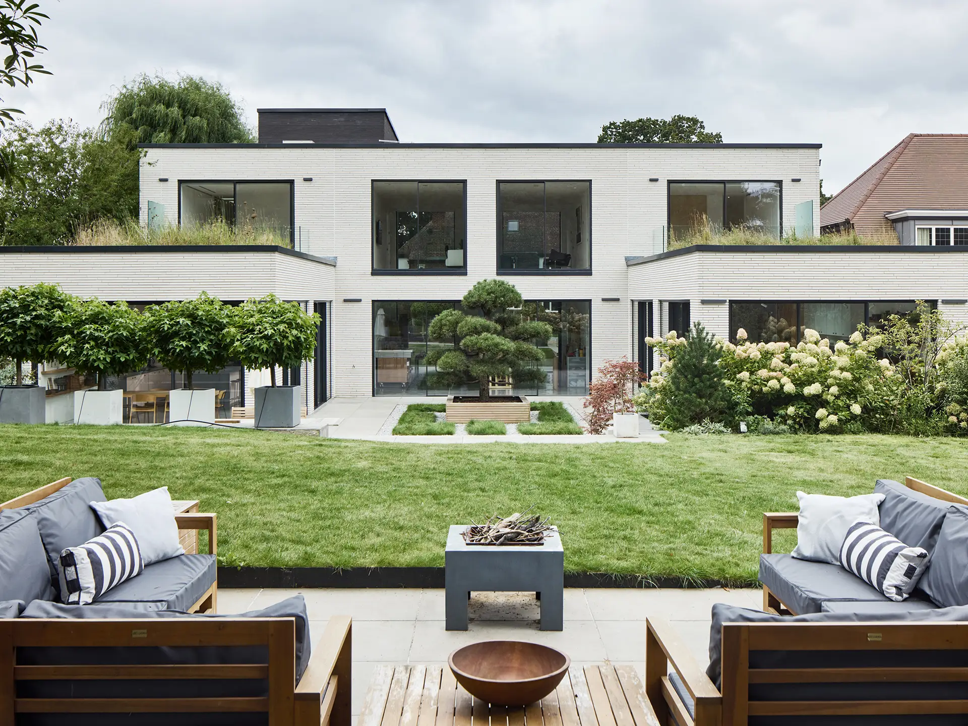 Gorgeous garden of two homes in Surrey, both including Pluck kitchens.