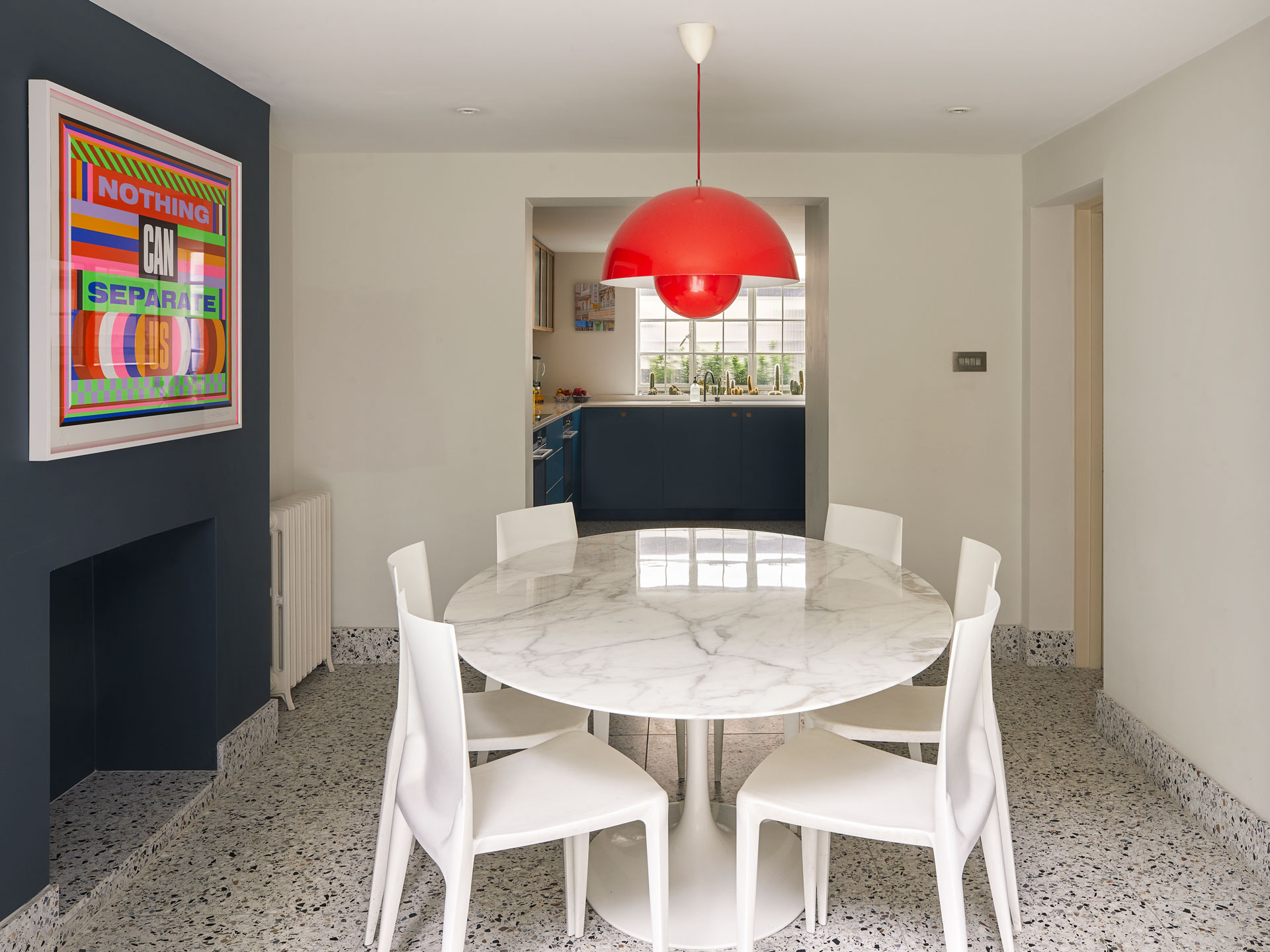 Blue, mustard yellow and wood Pluck kitchen in a Westminster townhouse basement.