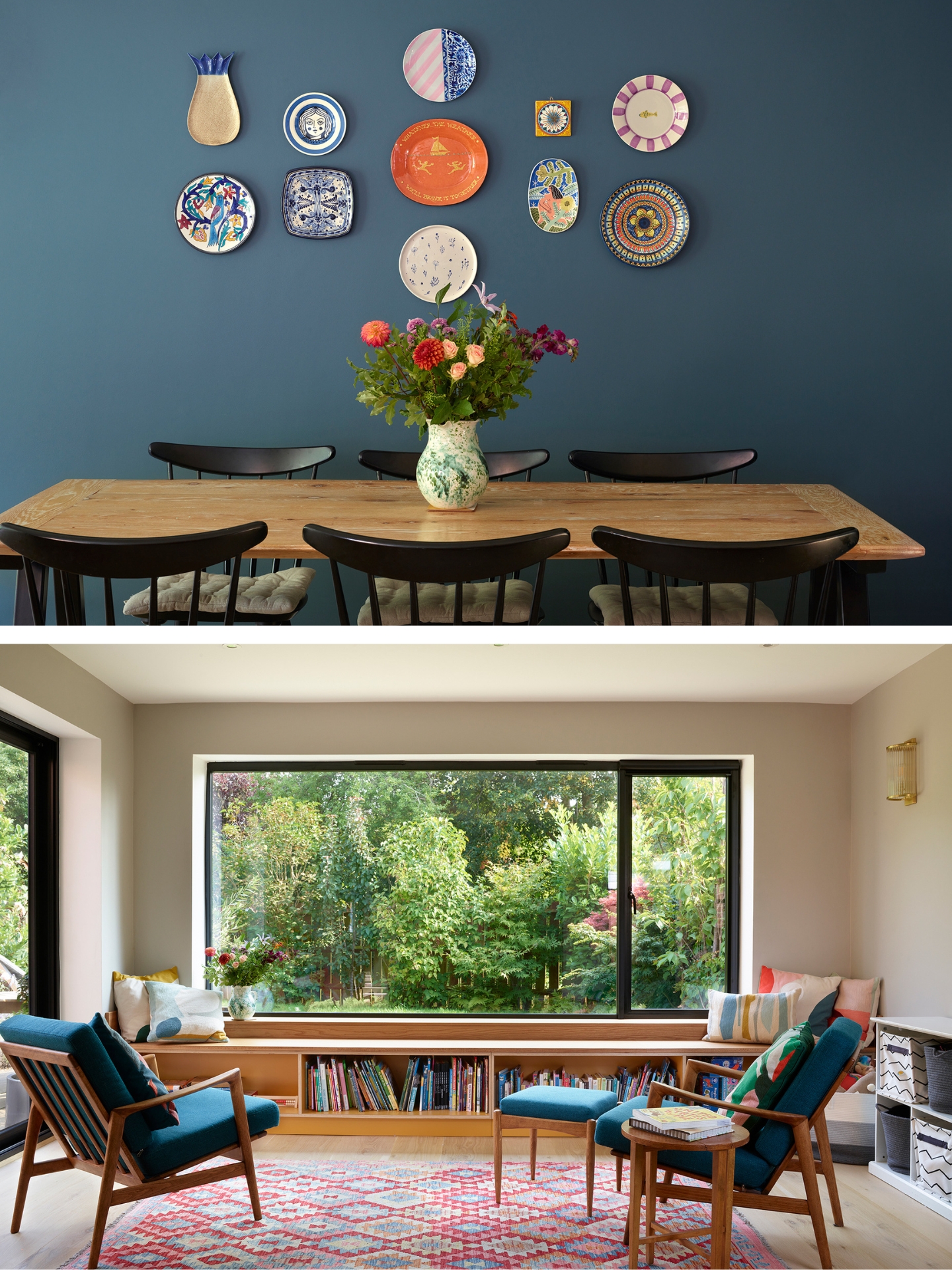 Wooden dining table with black chairs and a navy blue wall behind decorated with pretty plates.