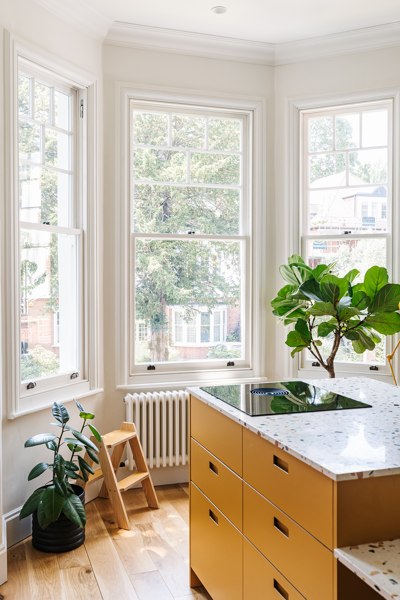 Set in a Victorian terrace, this pink kitchen is home to a young family who wanted to create pretty practical room with plenty of storage and a dining table.