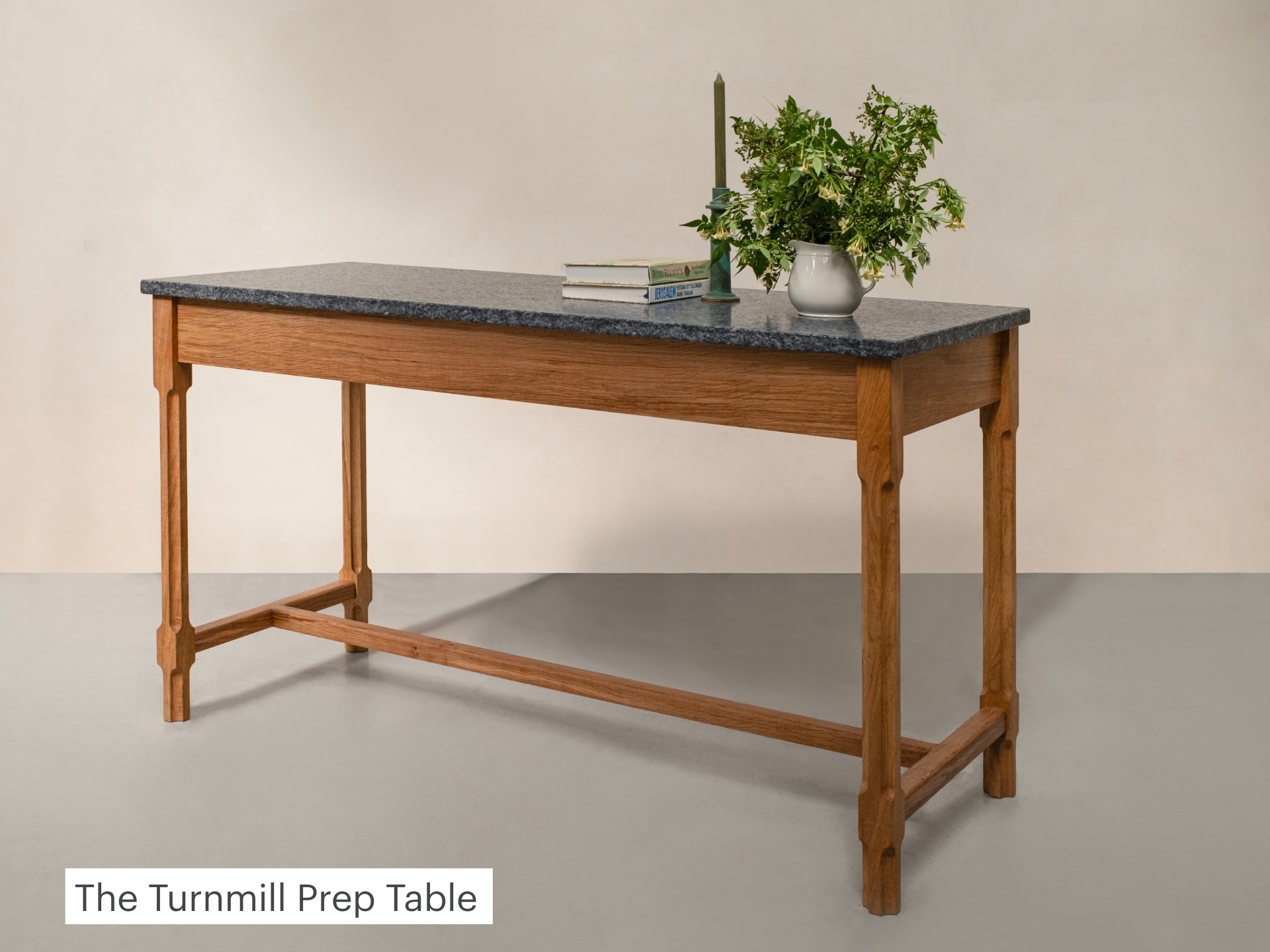 Turnmill Prep Table by Pluck kitchens with an oak frame and stone top.