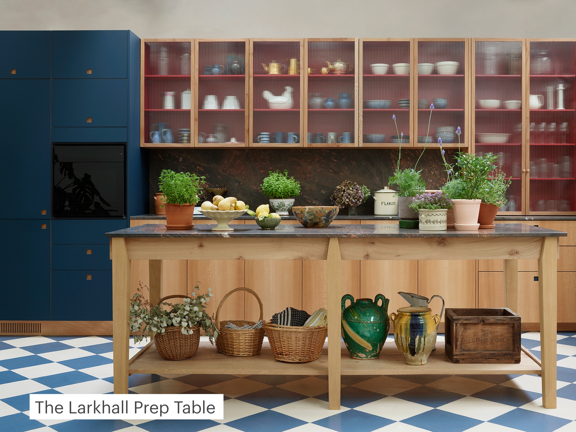 Large Prep table in the centre of a kitchen.