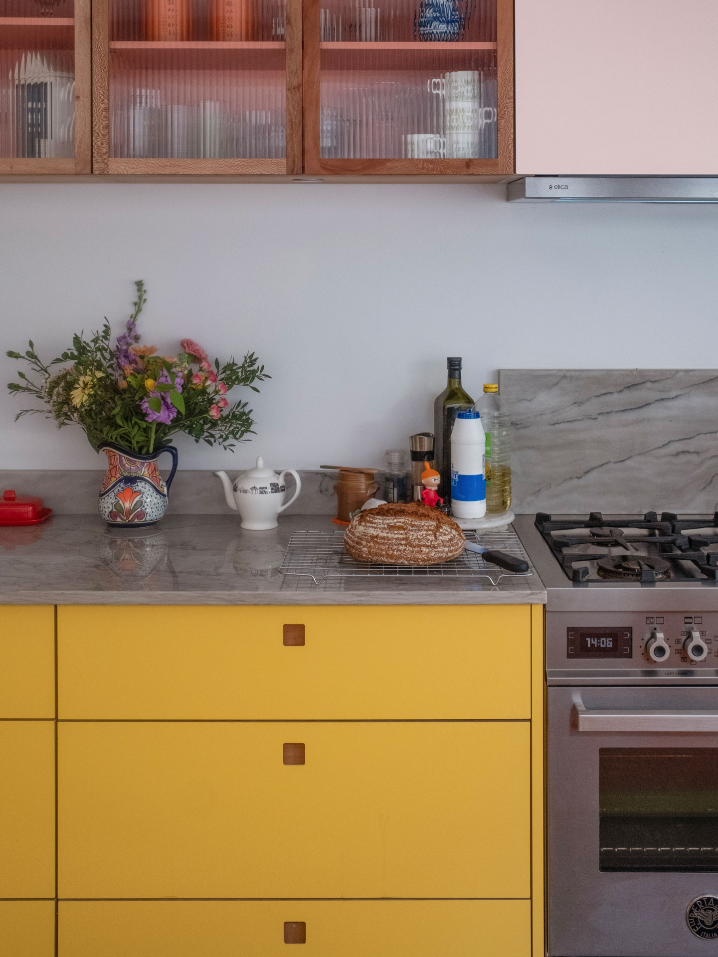 A Grade II listed family home in East London home with a Pluck kitchen including three colours and wood.