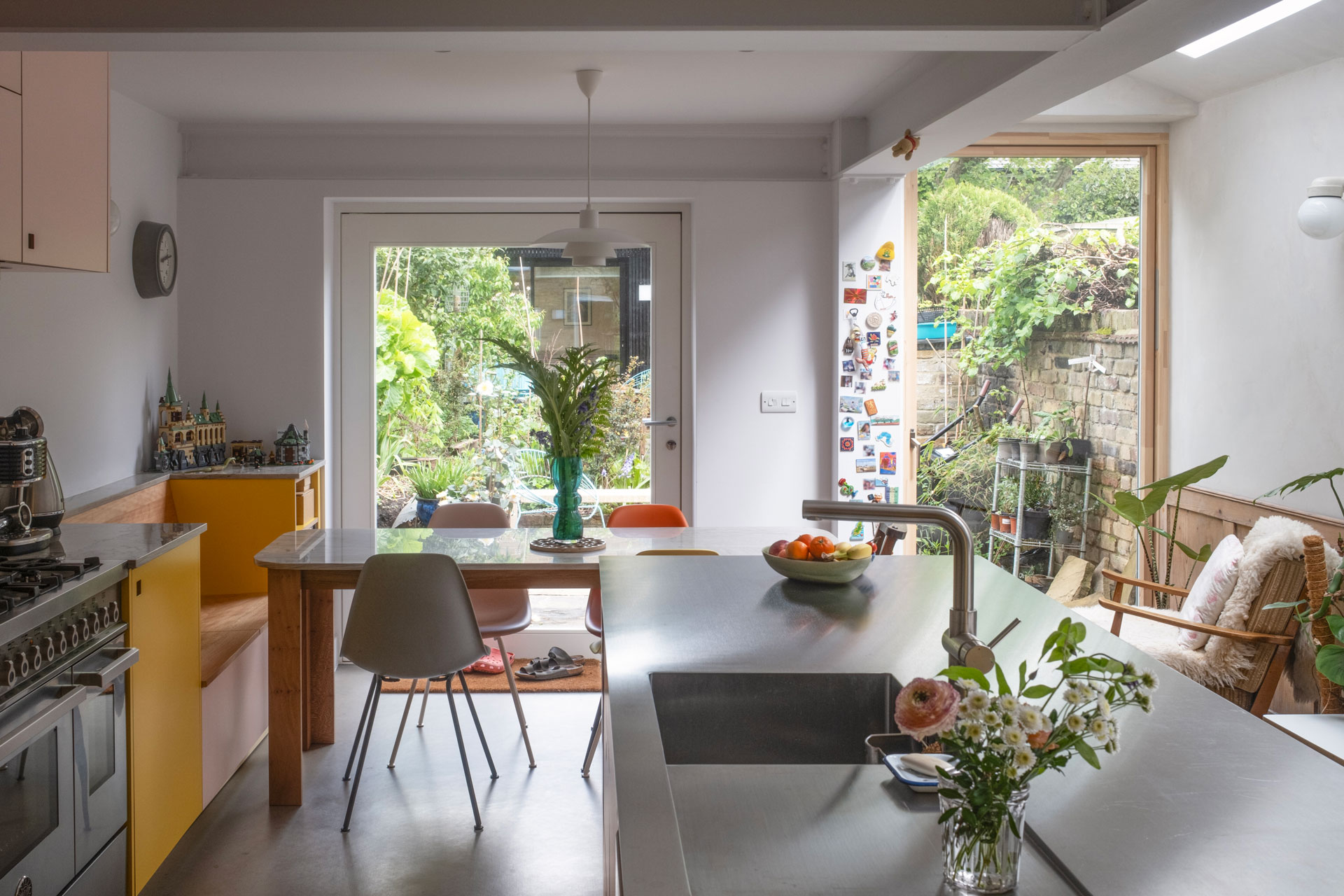 A Grade II listed family home in East London home with a Pluck kitchen including three colours and wood.