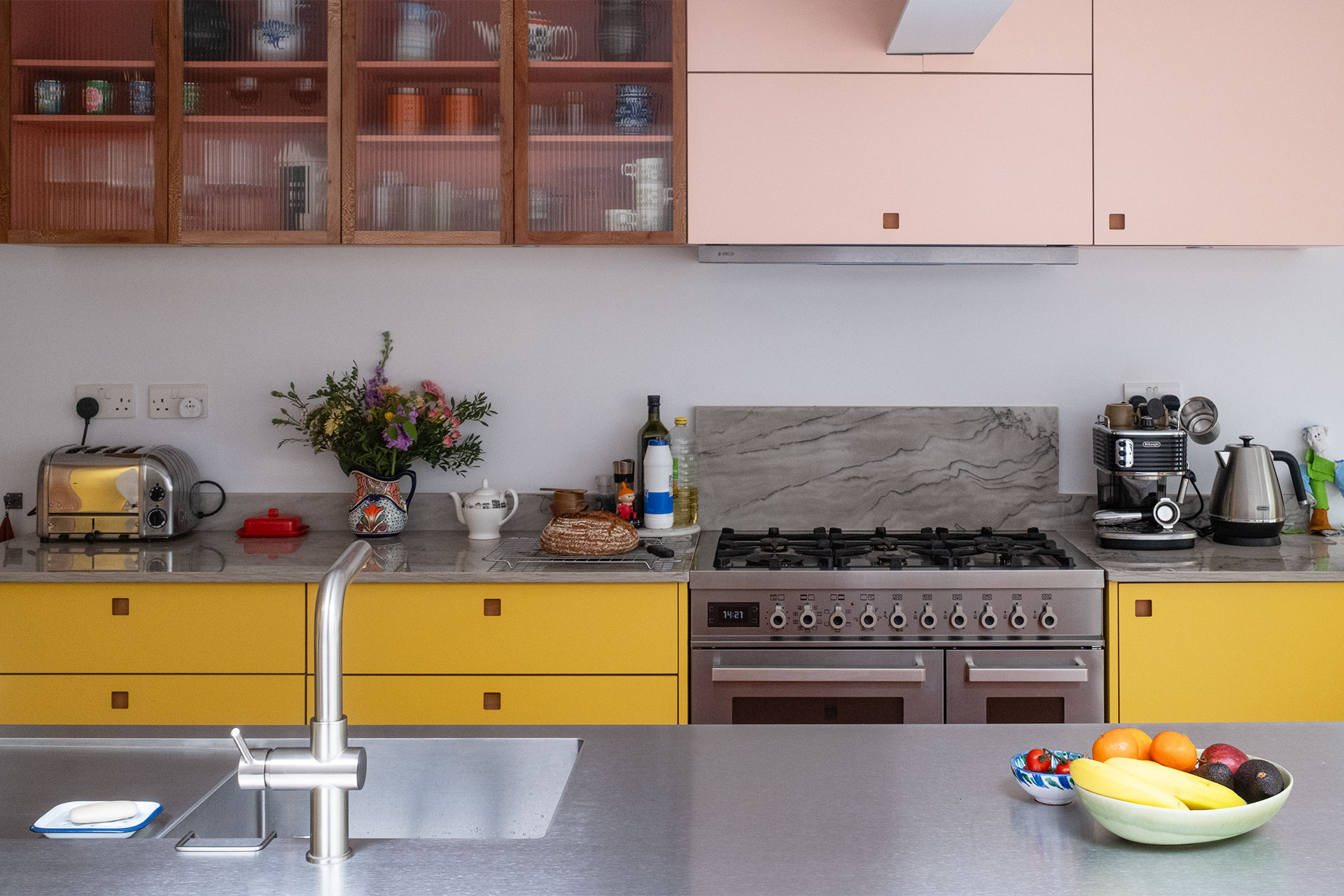A Grade II listed family home in East London home with a Pluck kitchen including three colours and wood.