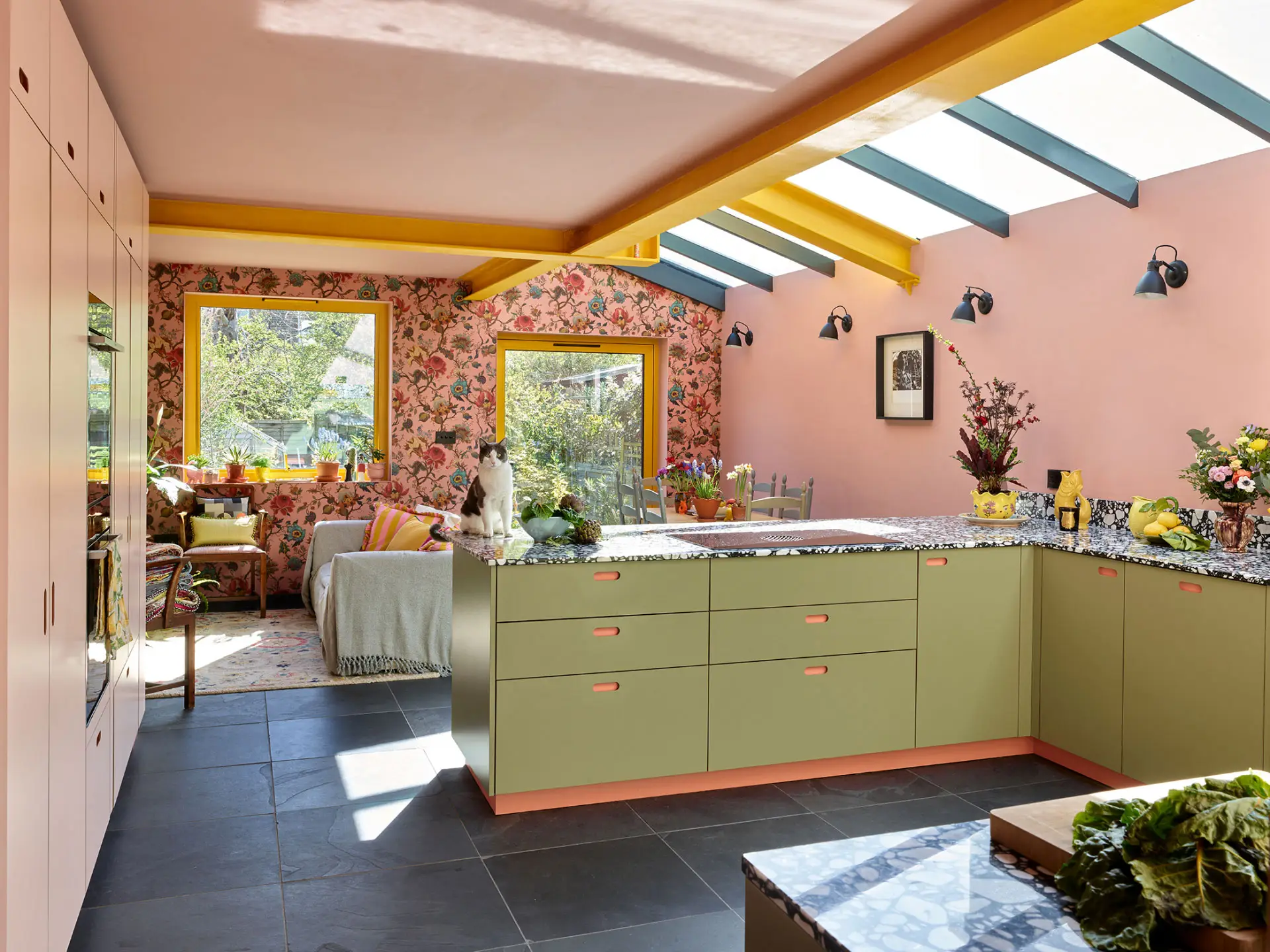 A colourful London kitchen with Pluck's cabinetry in an open plan room that is fun, cosy, calming and inviting.
