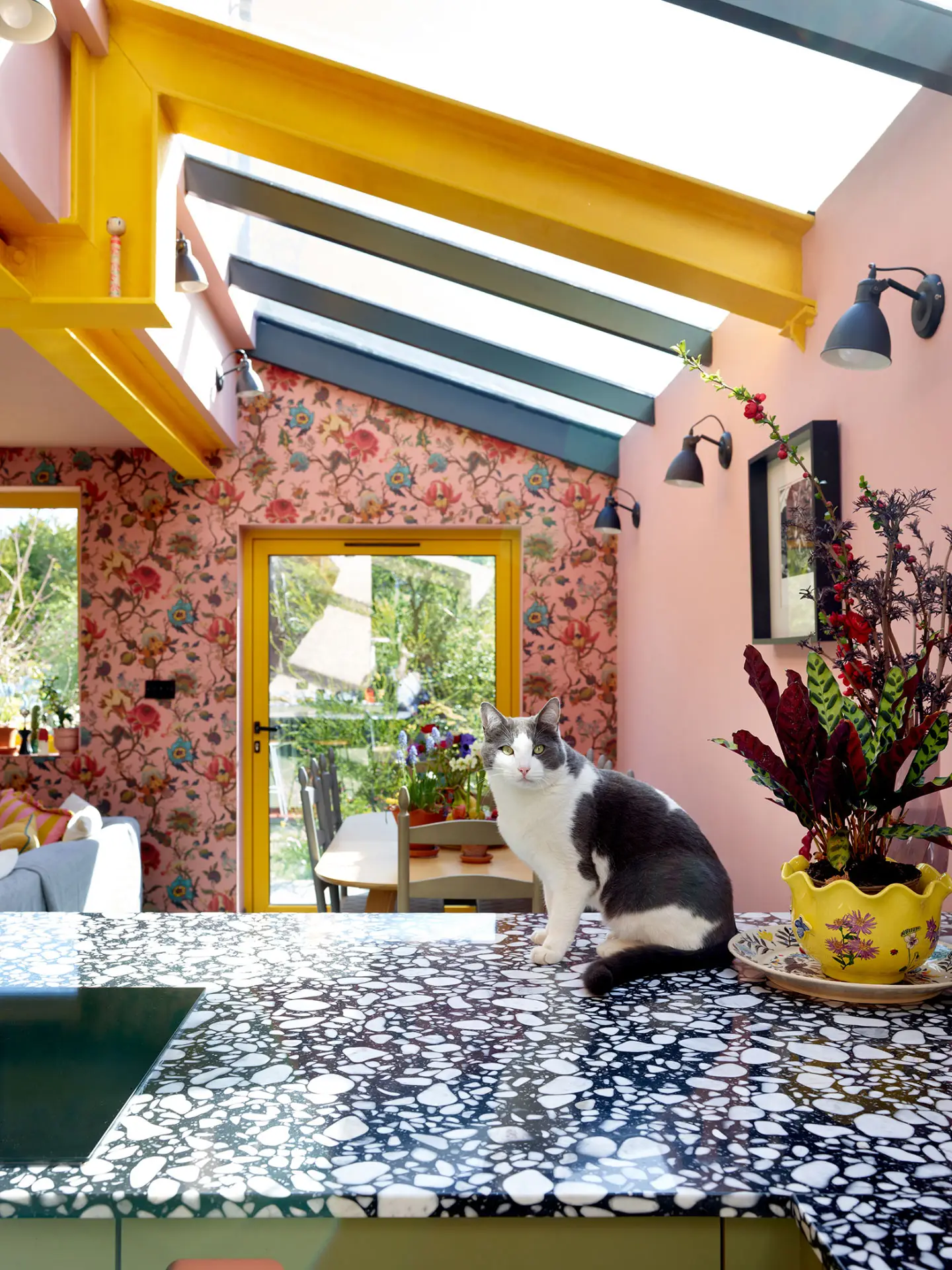 A colourful London kitchen with Pluck's cabinetry in an open plan room that is fun, cosy, calming and inviting.