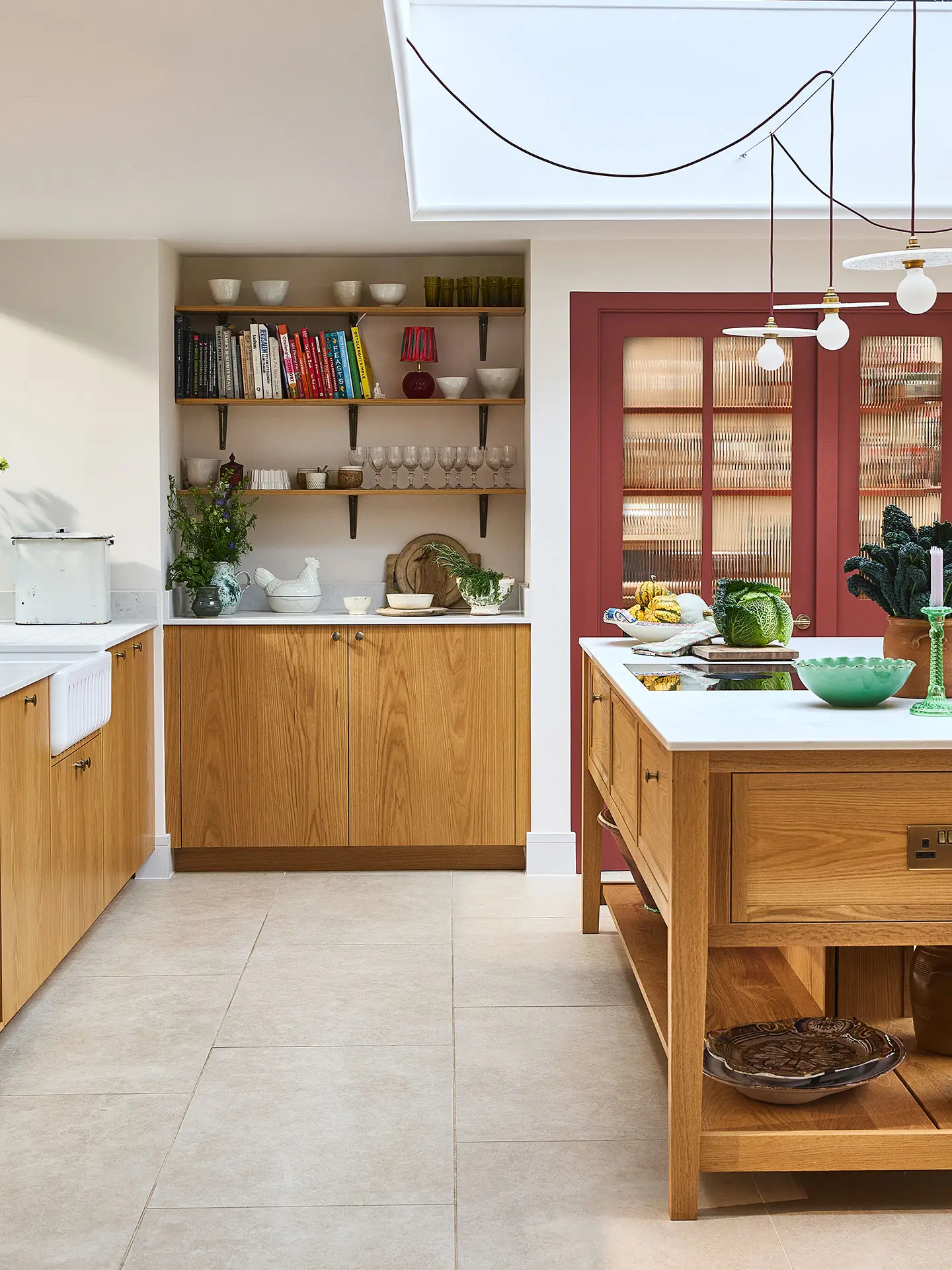 Pluck-Country-Kitchen-in-Surrey Pluck showroom with a london plane kitchen and painted chequerboard floor.