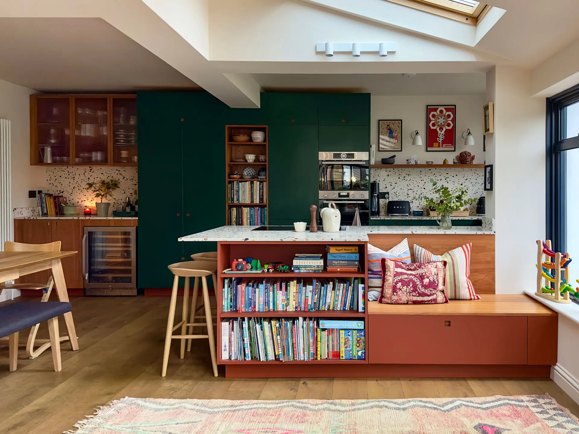 A Pluck kitchen in Essex with autumnal hues, part of an open plan space for a family with young children.