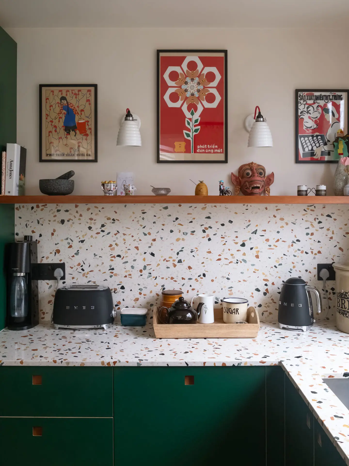 Pluck's Terracotta, Bonnington Green and Cherry wood cabinetry in a family kitchen in Essex with terrazzo worktops.