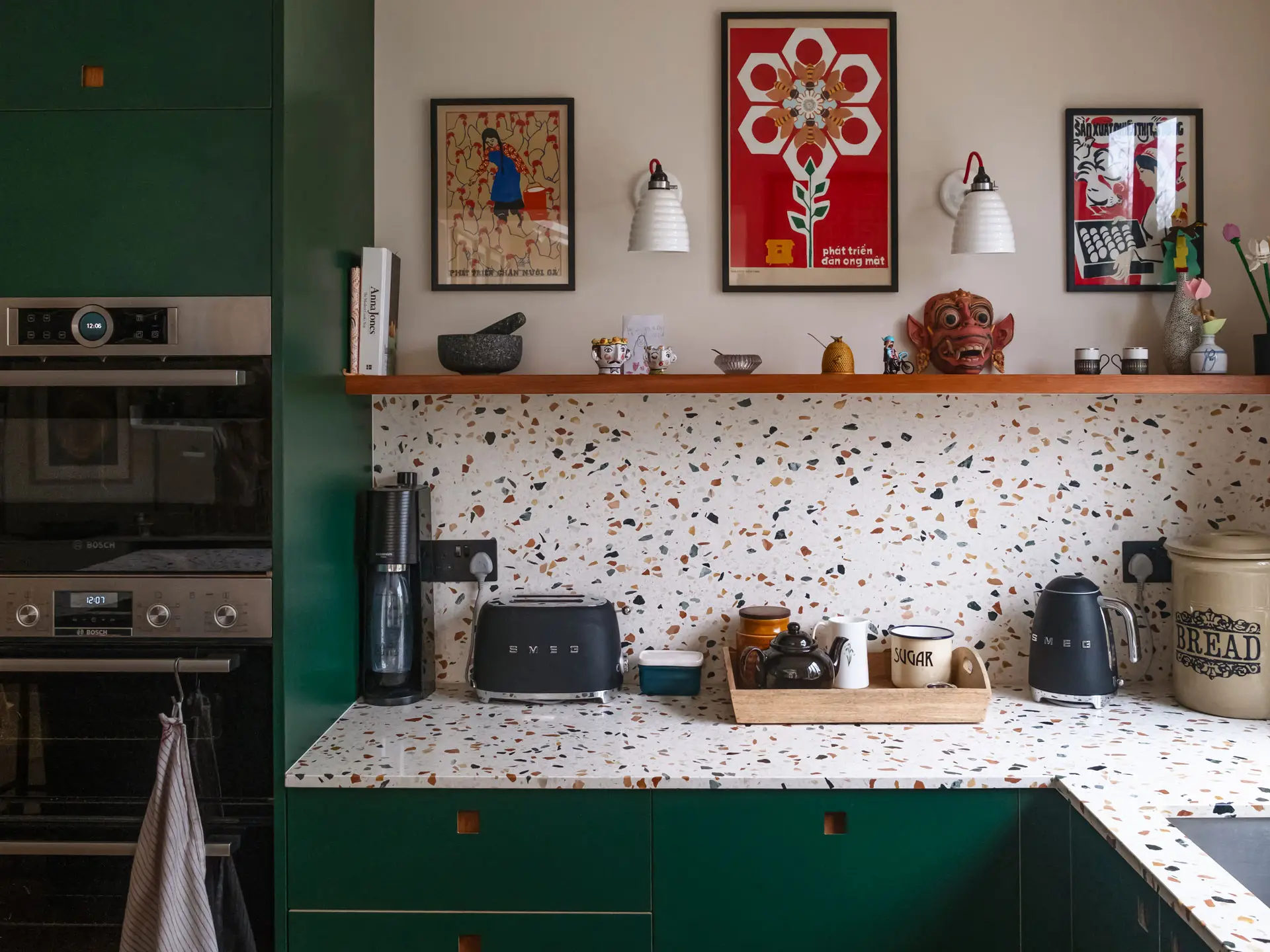 Pluck's Terracotta, Bonnington Green and Cherry wood cabinetry in a family kitchen in Essex with terrazzo worktops.