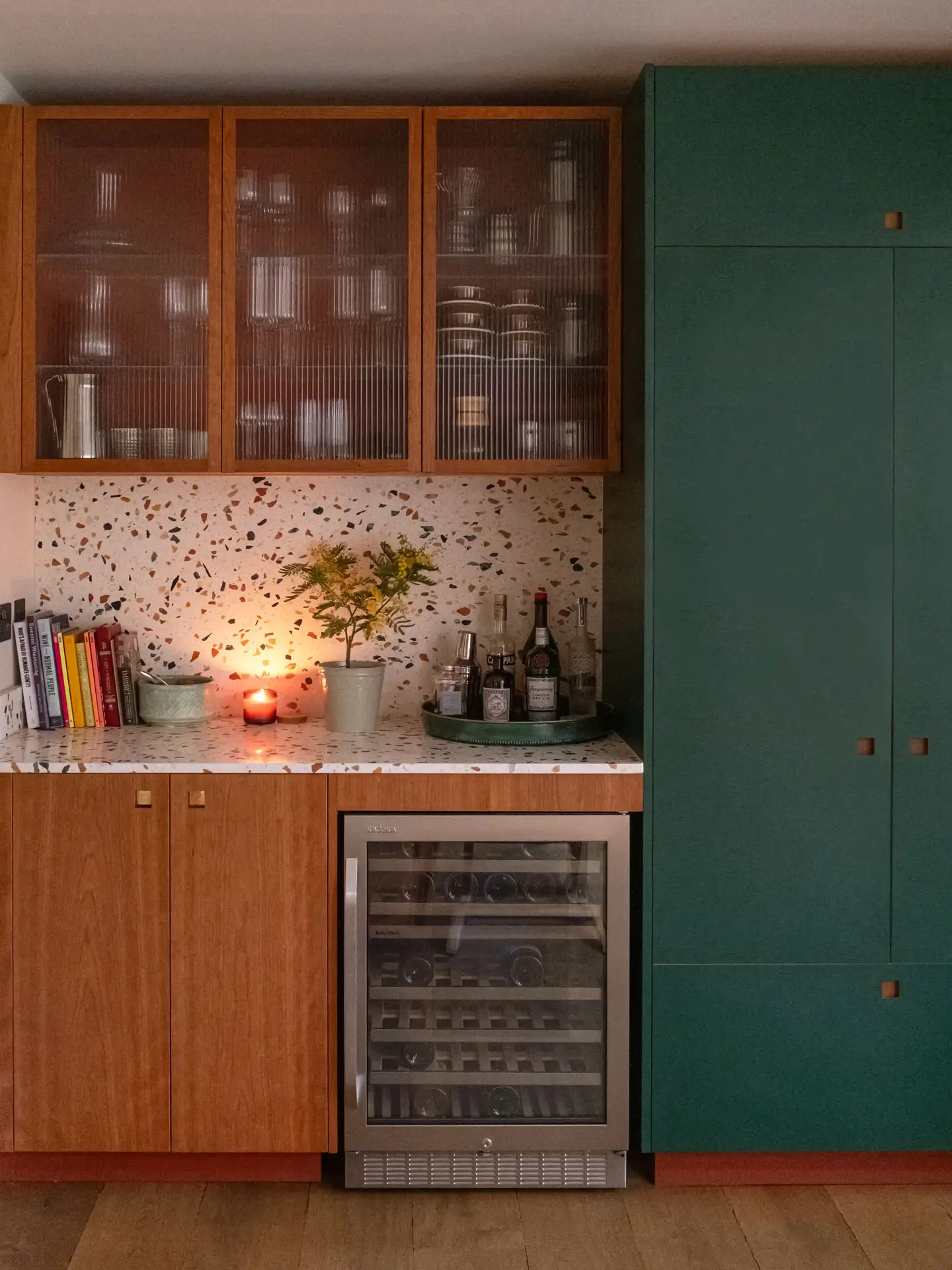 Pluck's Terracotta, Bonnington Green and Cherry wood cabinetry in a family kitchen in Essex with terrazzo worktops.