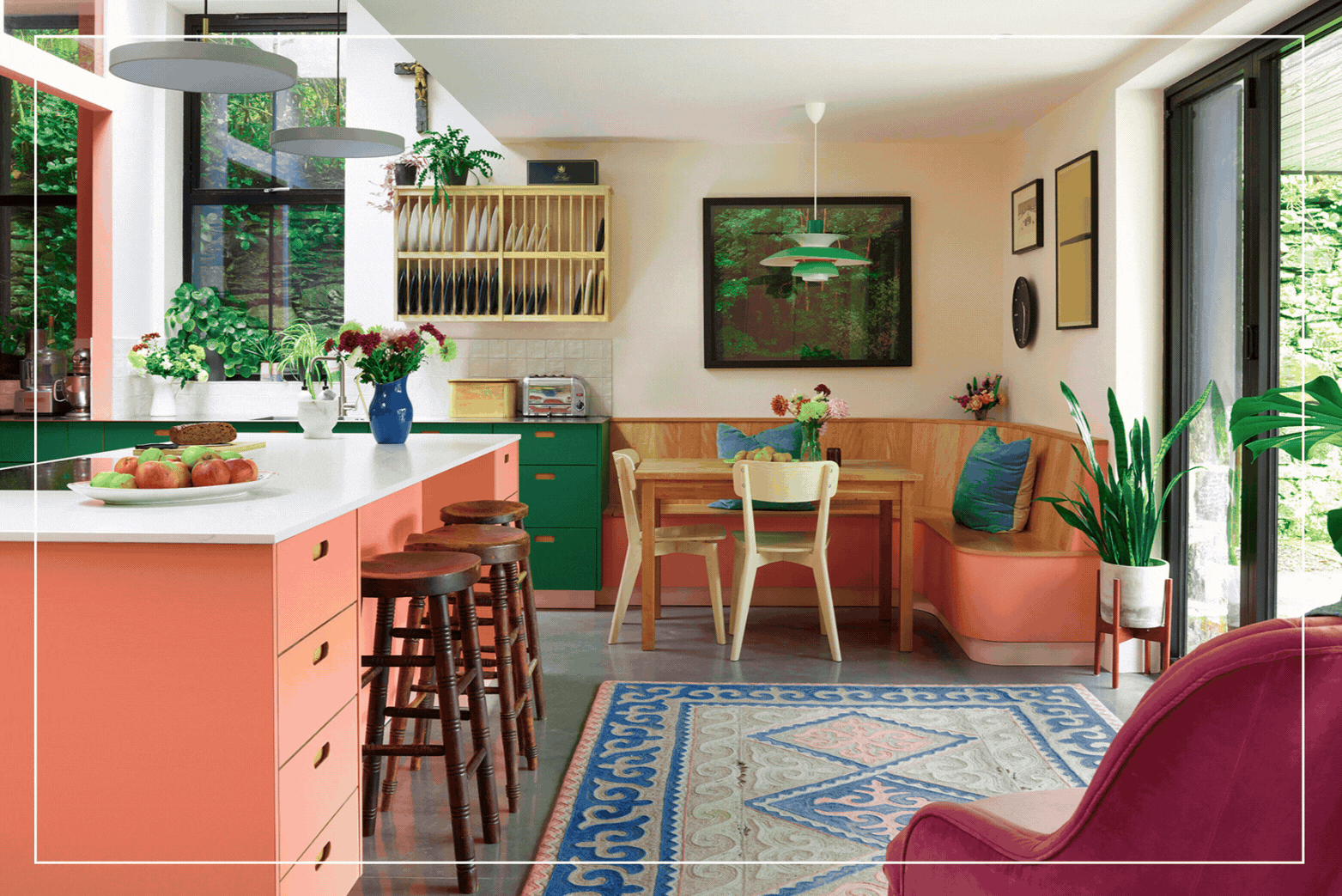 Pluck Kitchens Journal Story of a Kitchen 02 Pink and green Pluck kitchen with a large kitchen island and banquette seating.