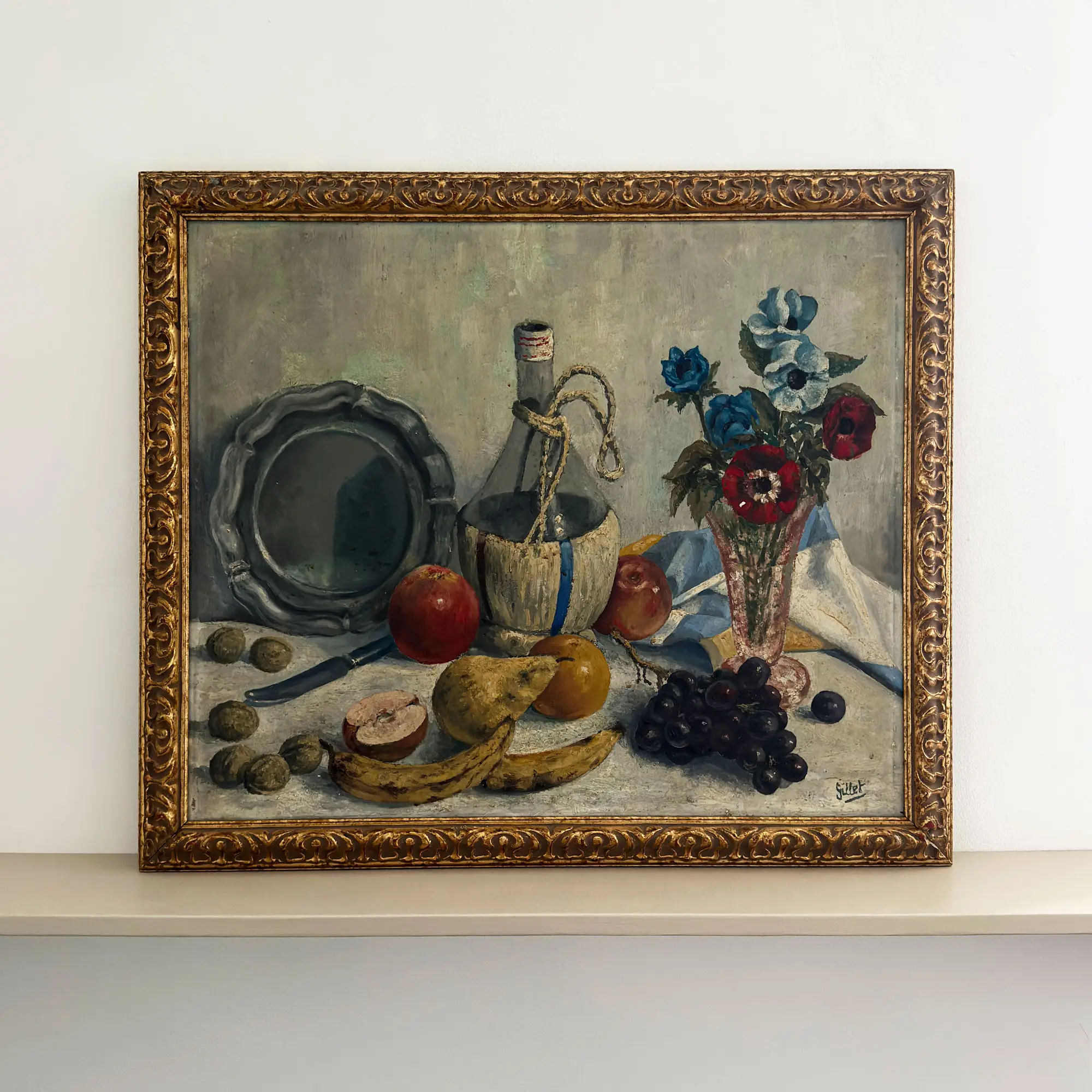 Large French still life painting with fruit, flowers, a decanter and plate, framed in gold