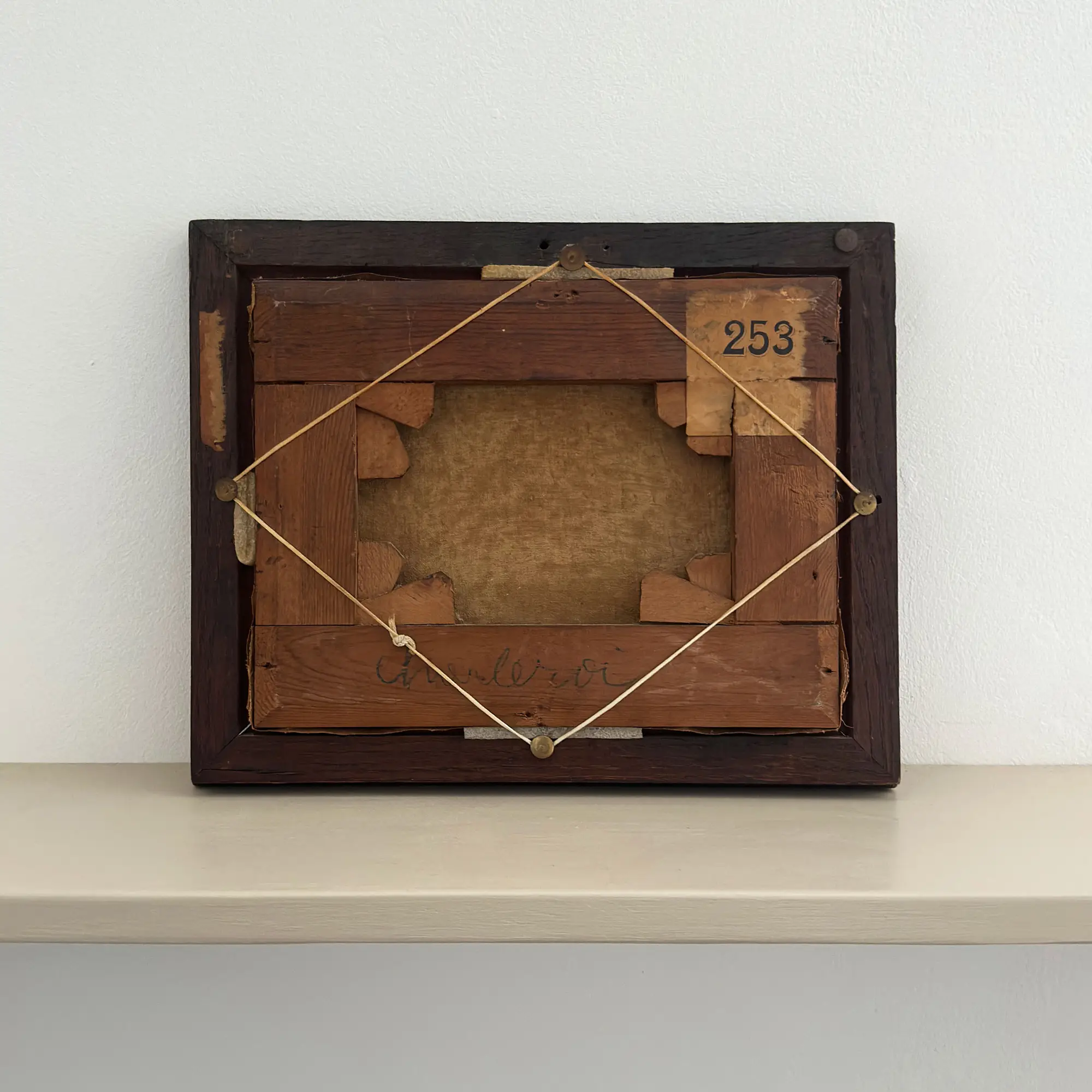 Small 19th Century table top scene painting in a dark wooden frame.