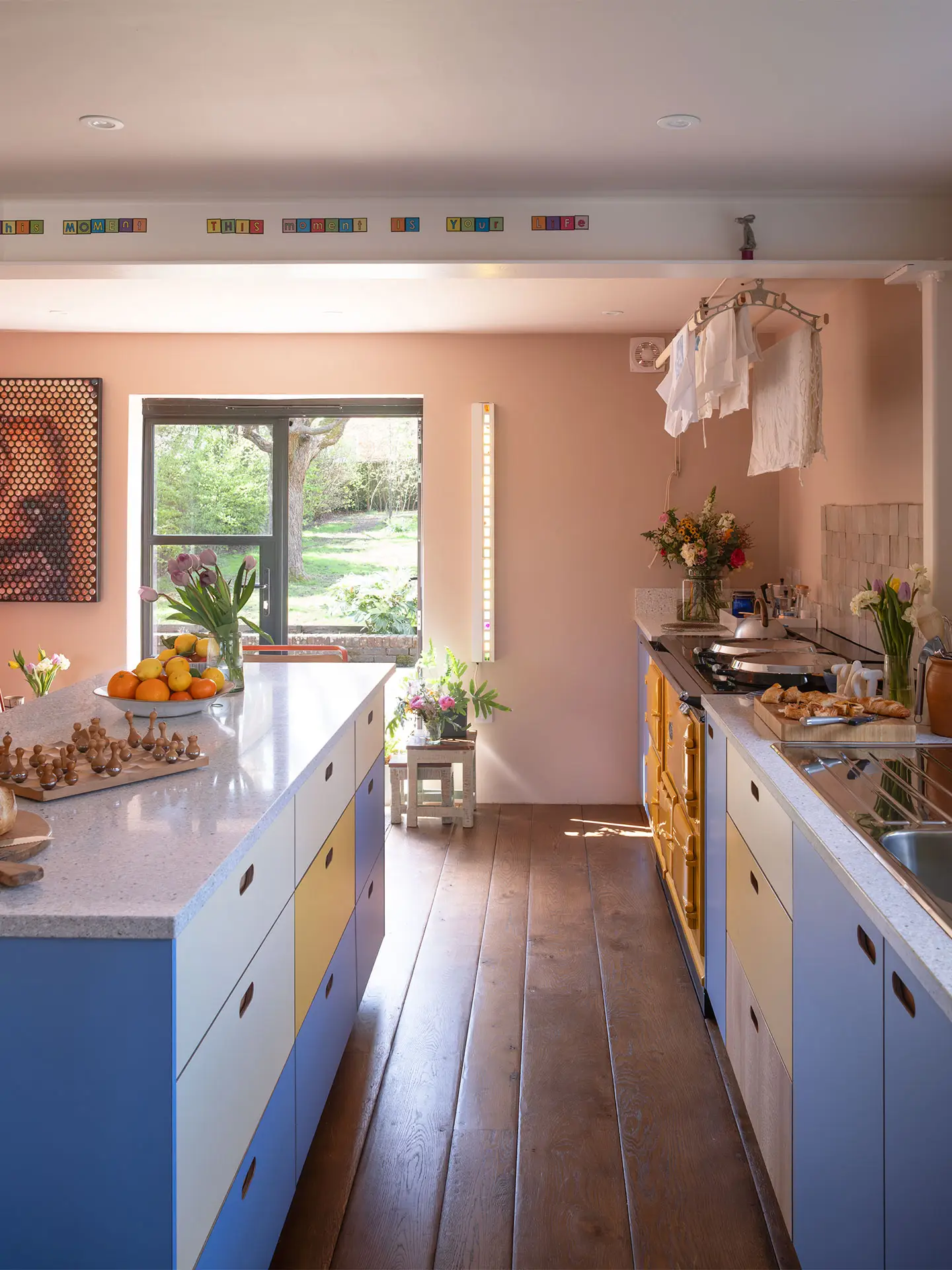 A kitchen in Haywards Heath packed with colour, including Milton Blue and two Pluck yellow hues.