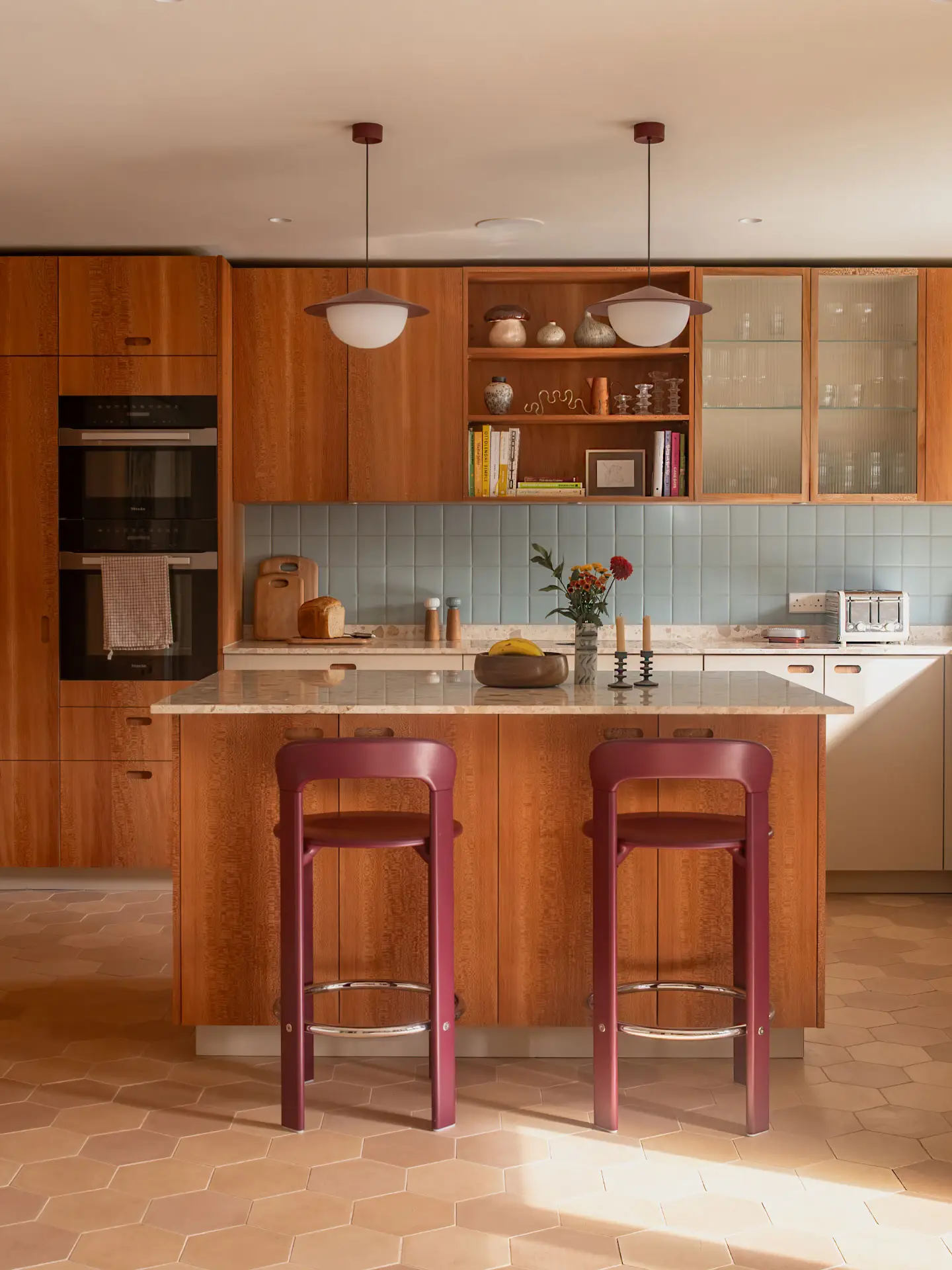 A large Pluck kitchen with London Plane wood cabinetry and a island